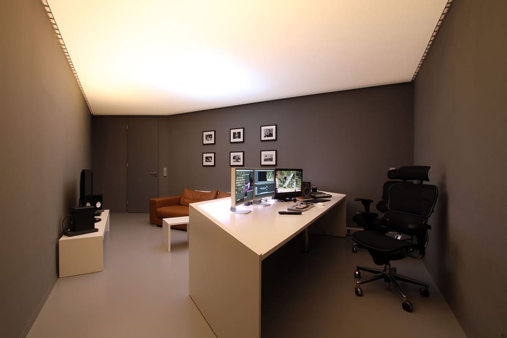 Editing station in the Bigfish film studio under warm lighting