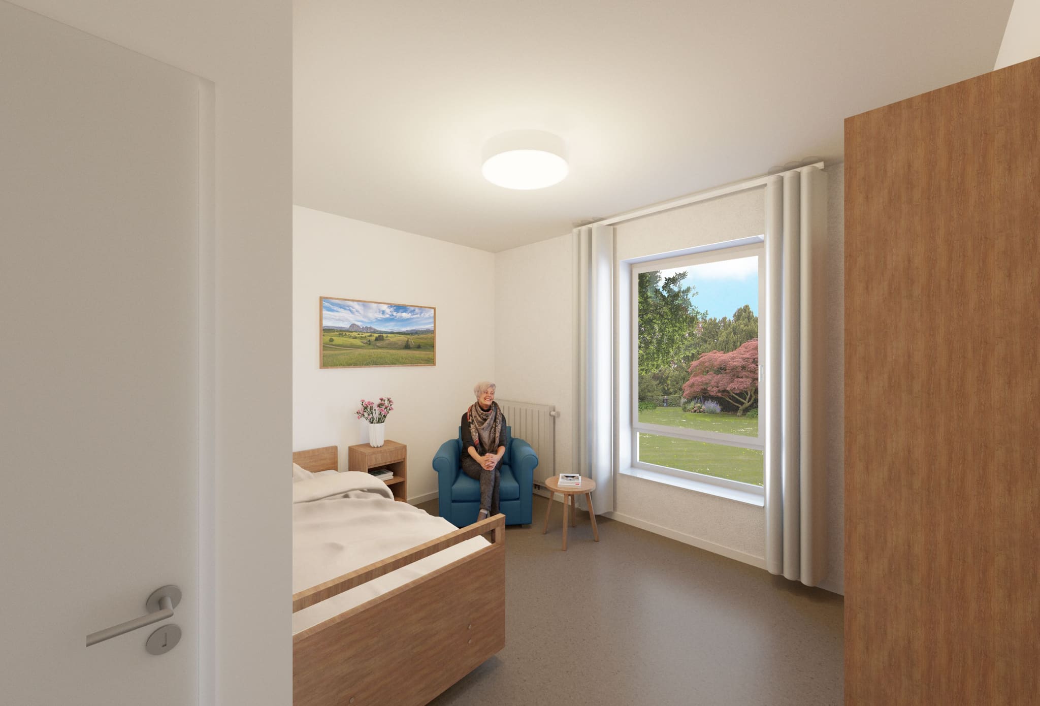 View through an open door into a single room with care bed, bedside table, blue armchair and large garden window